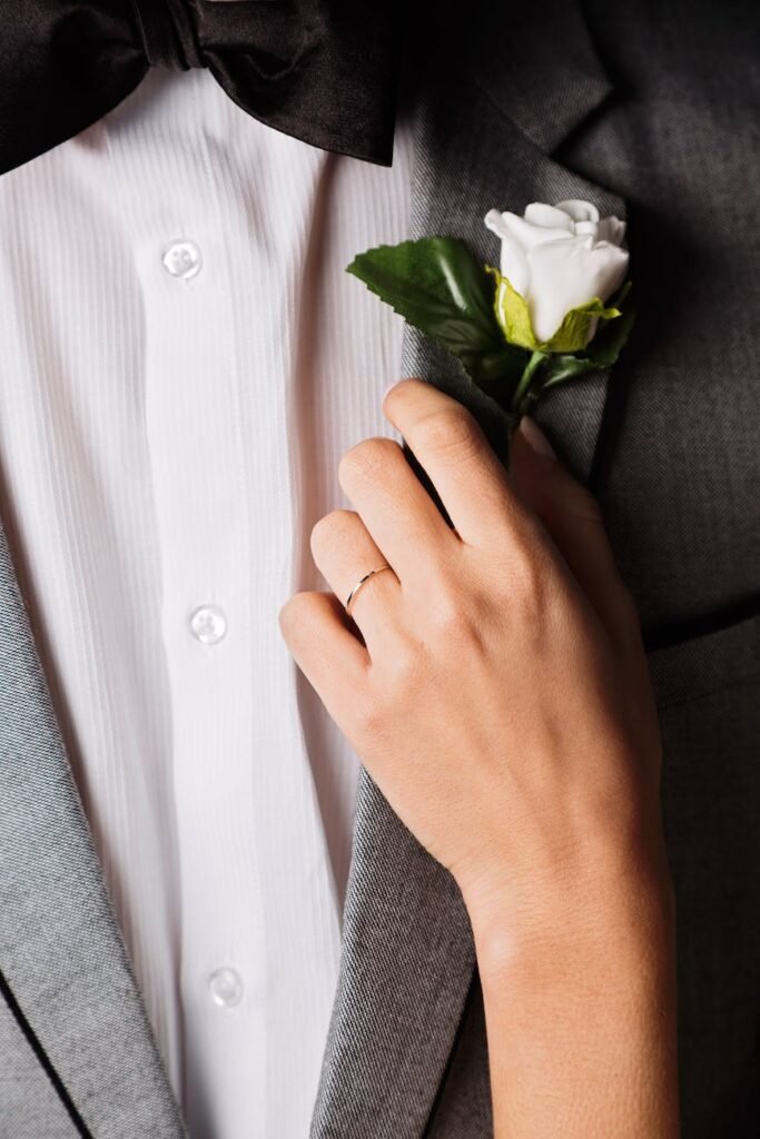 person holding white rose